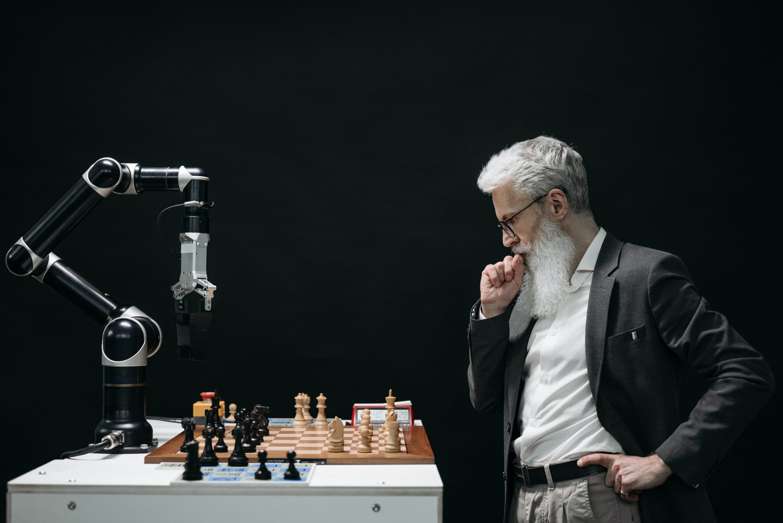 Man playing chess against a robot to show Integrity's expertise with AI